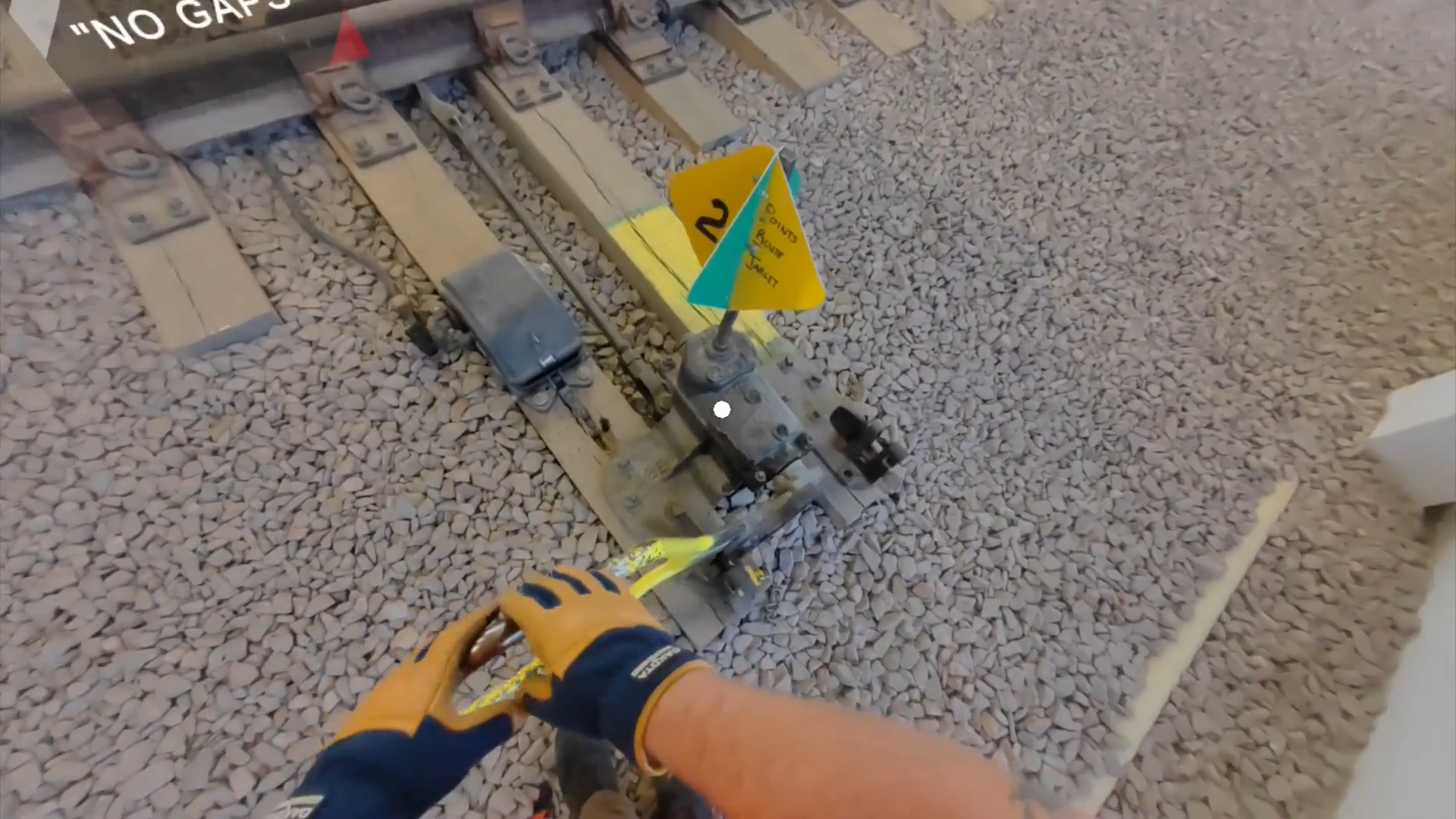First-person hands-on view of manual switch throw with No Gaps instruction prompt