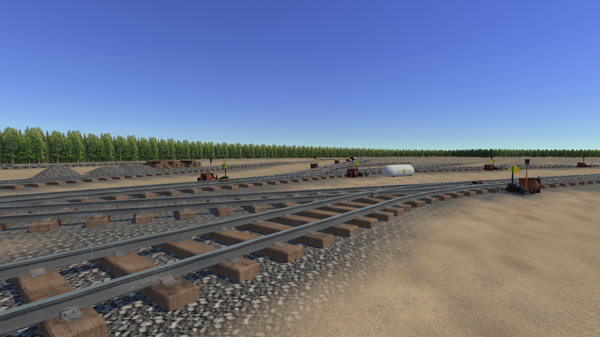 Symington yard wide view with switch mechanism, green flag, and warning tank